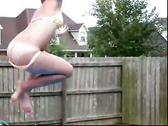 Cutie mooning ass on jump into pool