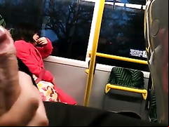 Dude beats off on a lovely Asian lady in the train