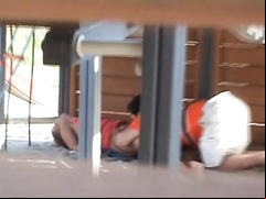 Adults copulating on the playground while filmed