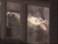 Lovely babe filmed masturbating through apartment window