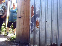 Shop employees piss in the dirt outside