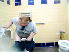 Chubby blonde uses the public toilet